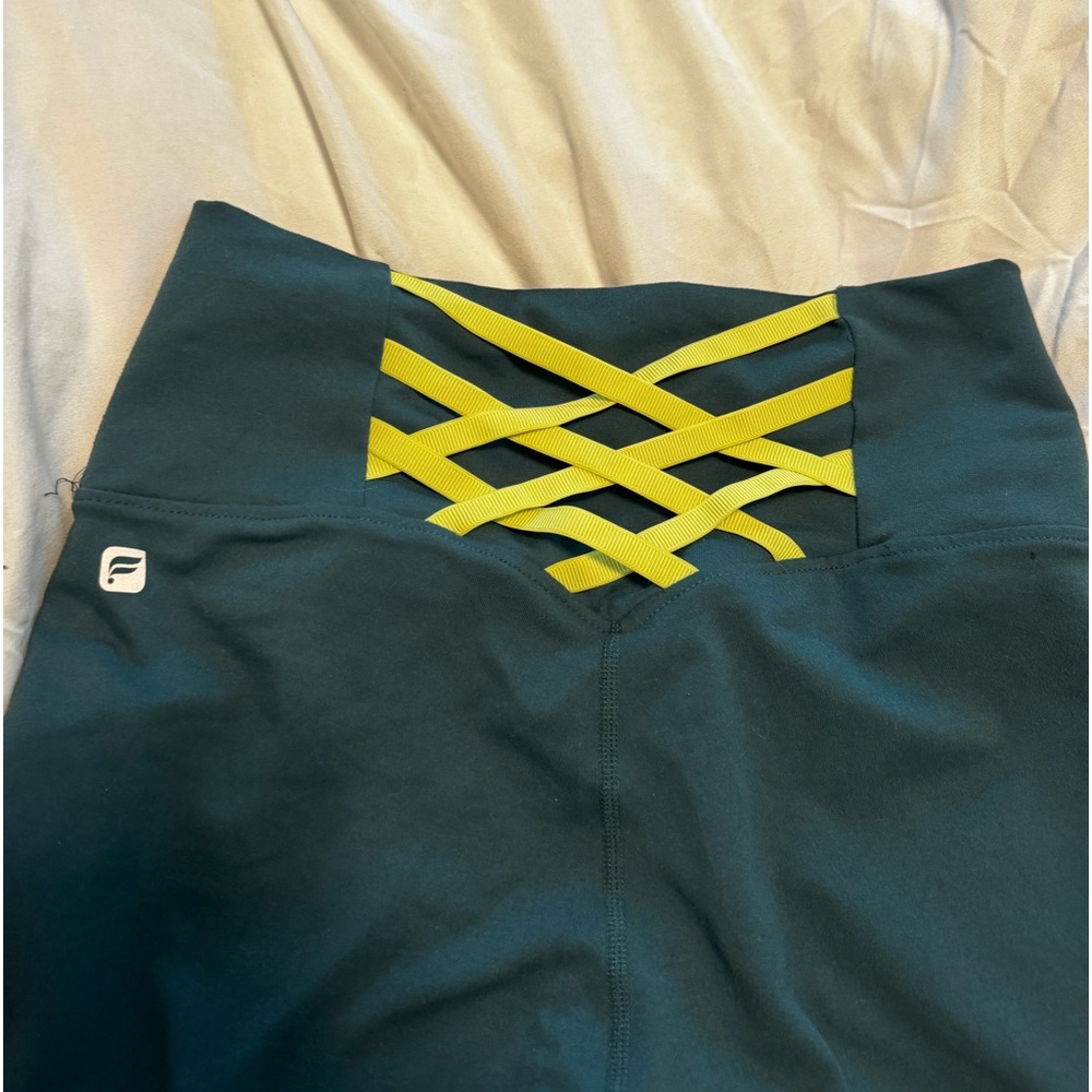 teal fabletics legging with cross back